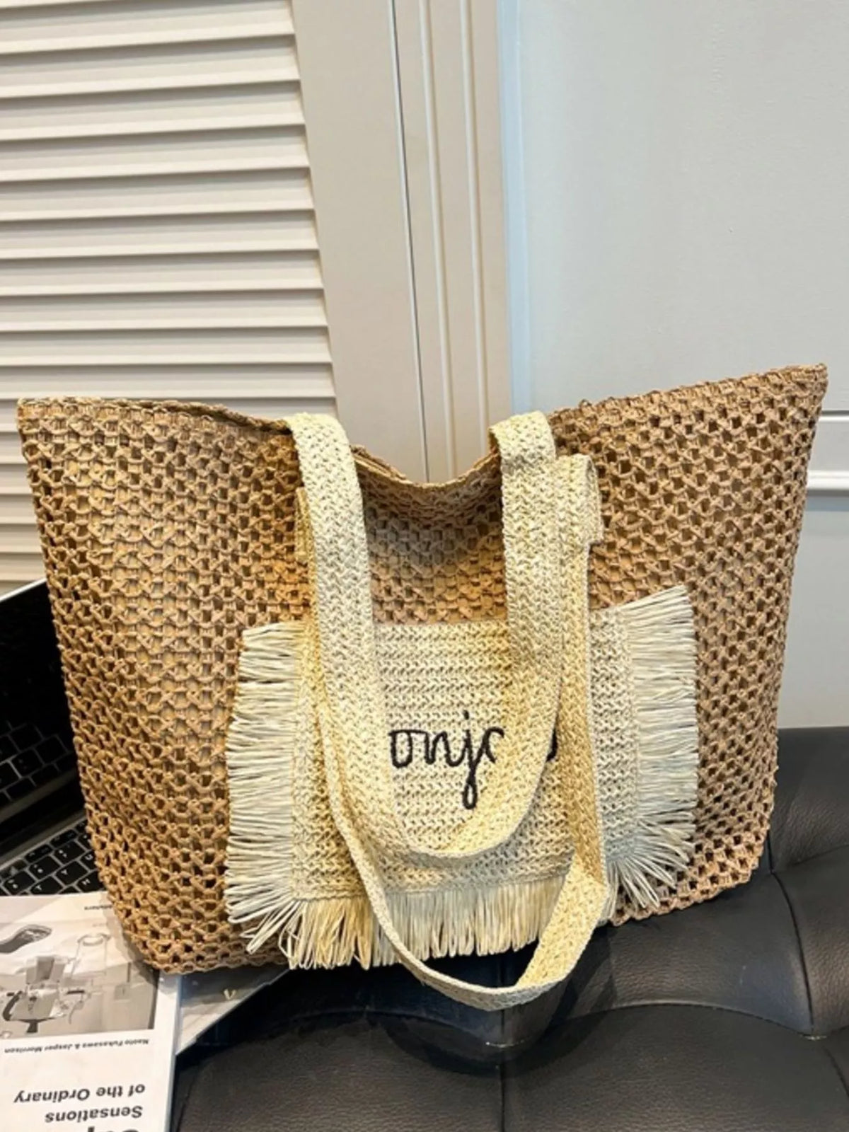 Woven straw bag with fringe detail