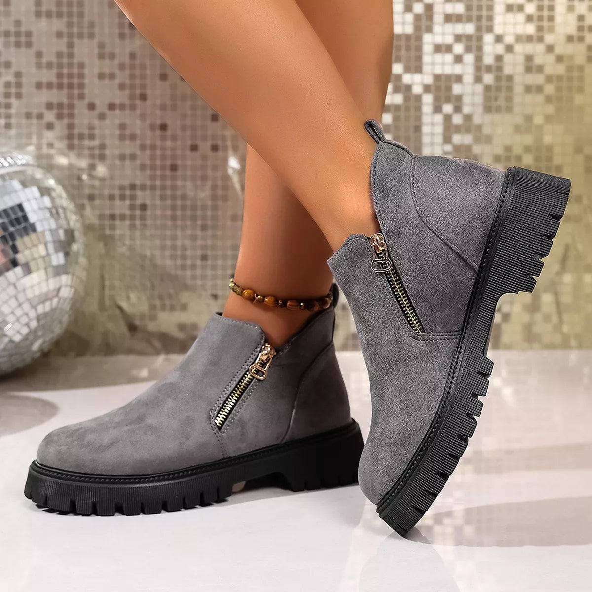 Round toe side zip ankle boots heel and sole detail