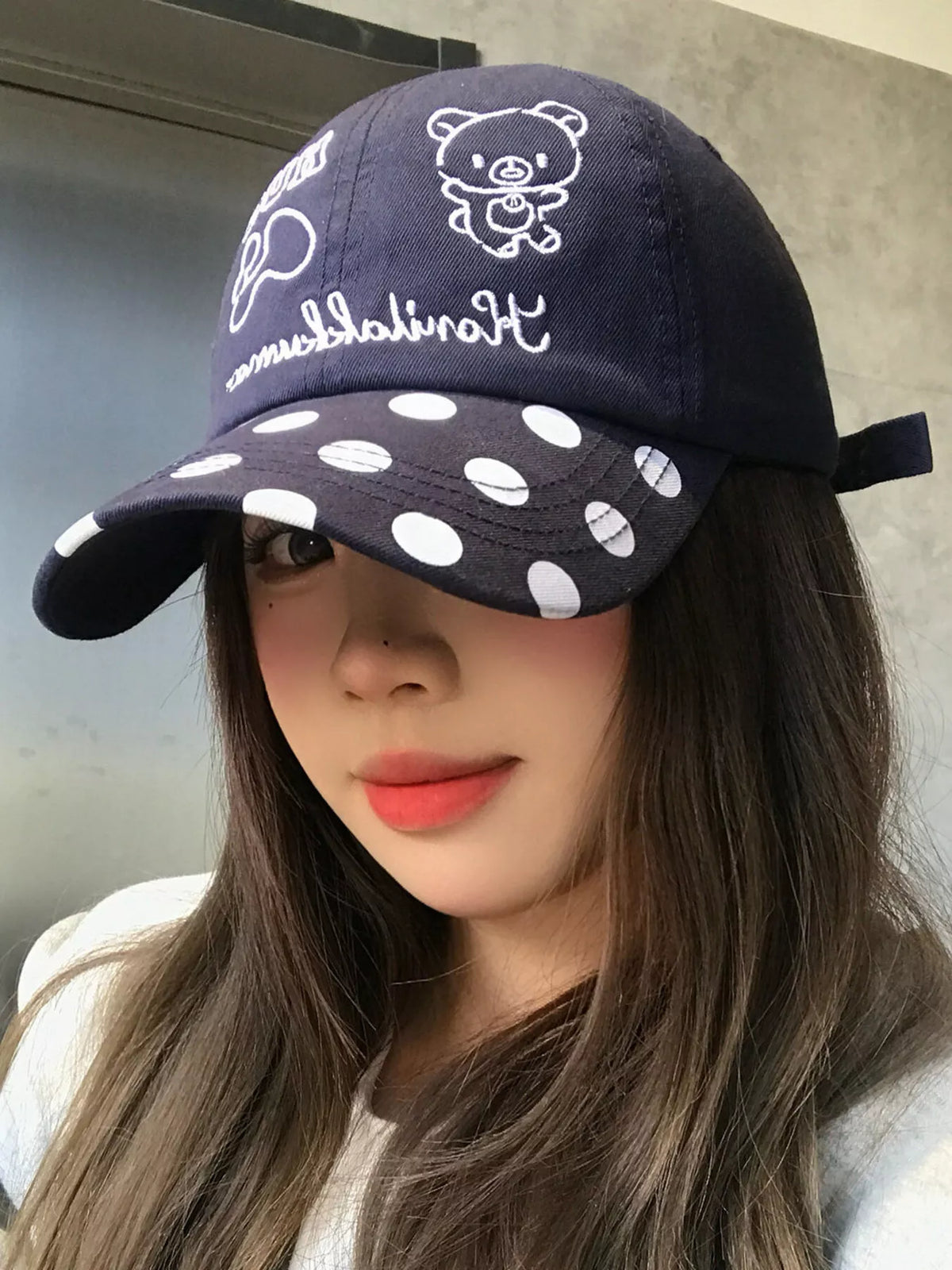 Polka dot baseball cap shown in navy blue