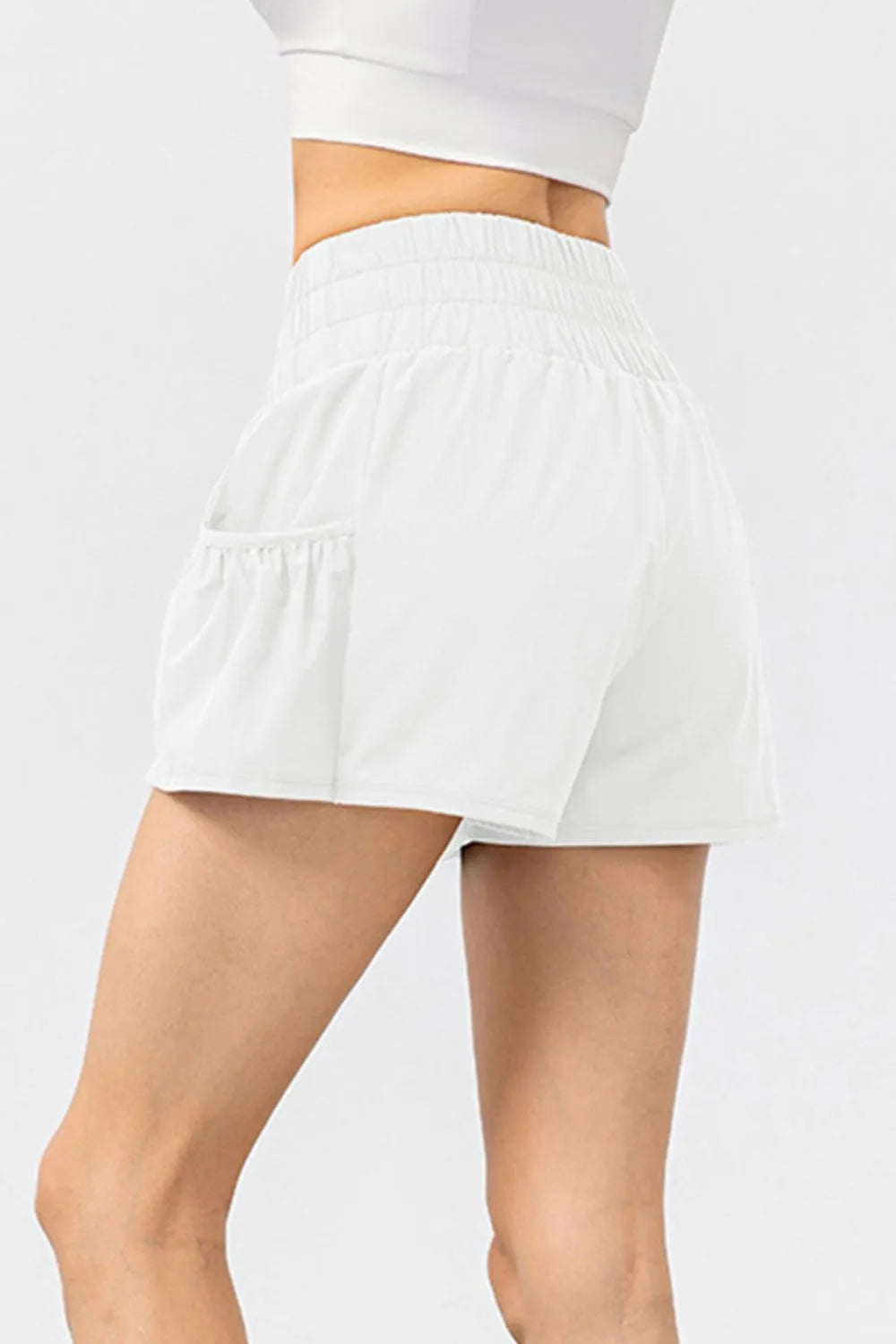 Elastic waist pocketed active shorts angled view