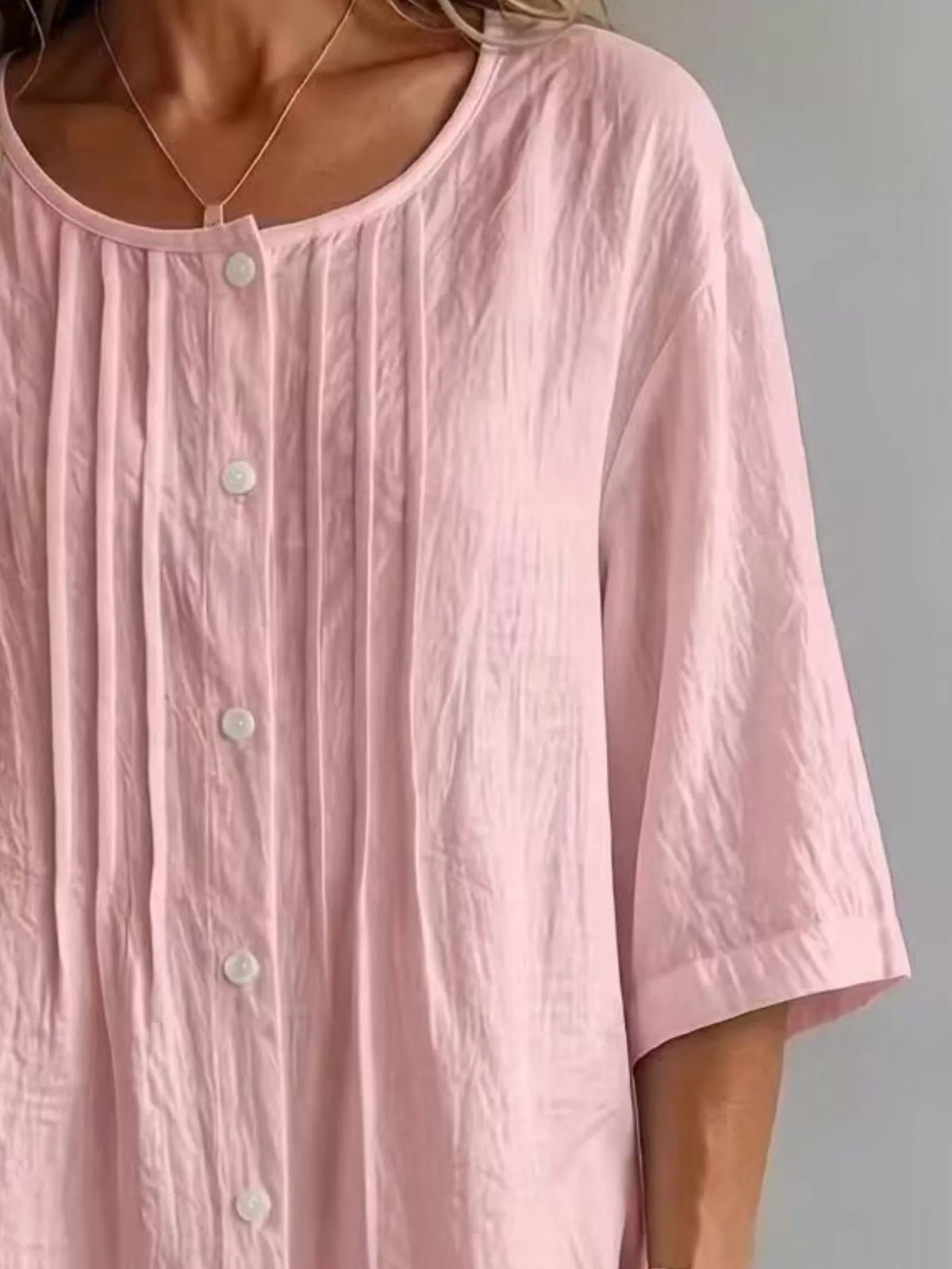 Plus size round neck blouse styled with trousers