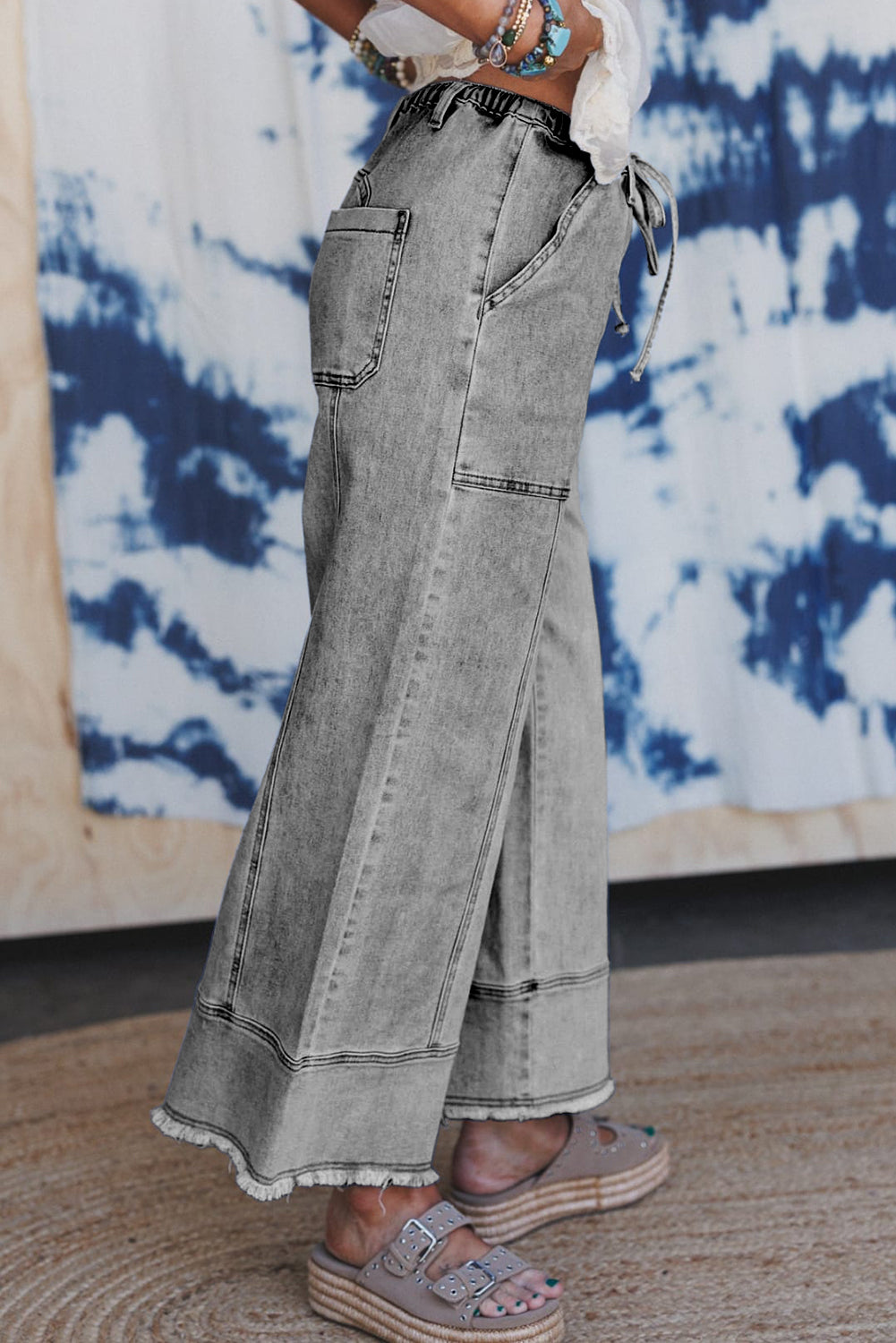 Wide leg jeans raw hem detail close up
