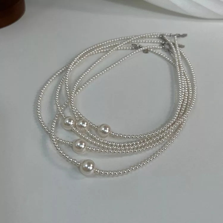 White pearl bead choker necklace, side view