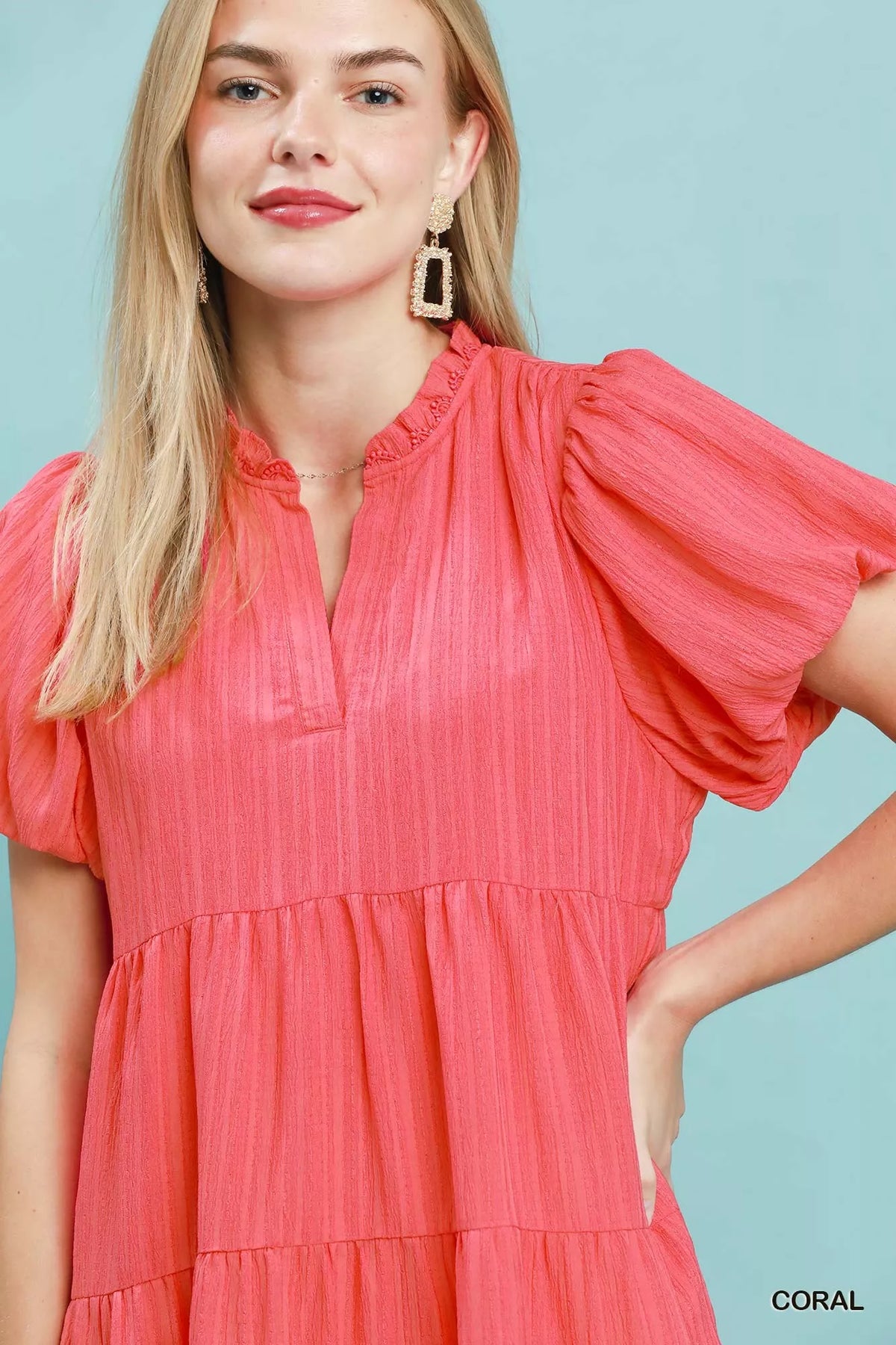 Coral puff sleeve tiered babydoll mini dress front view