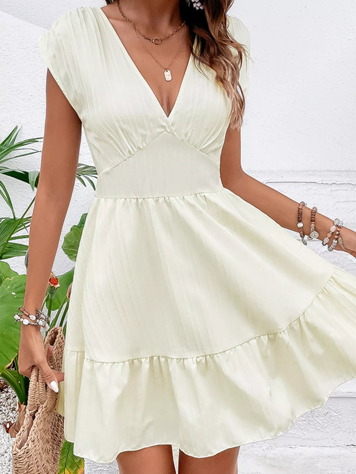 Close up of cap sleeve and shoulder seam on mini dress