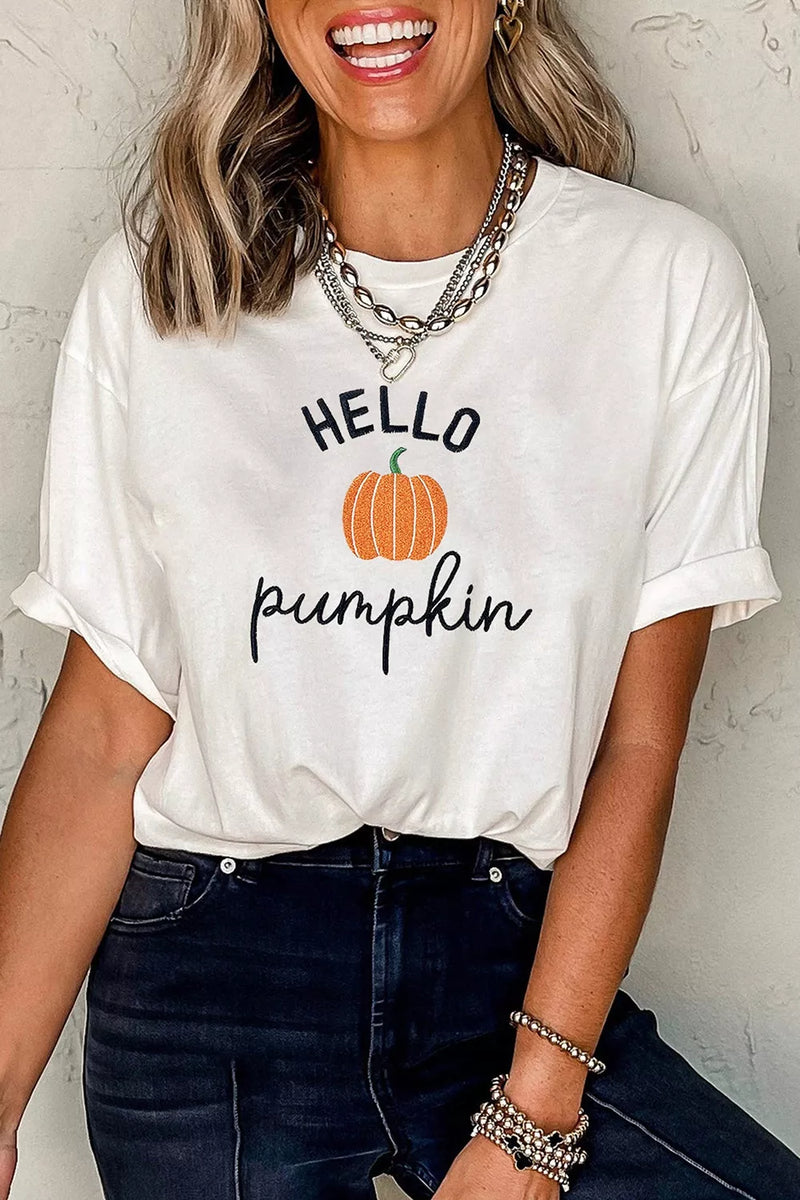 Embroidered pumpkin slogan tee in white shown on a model