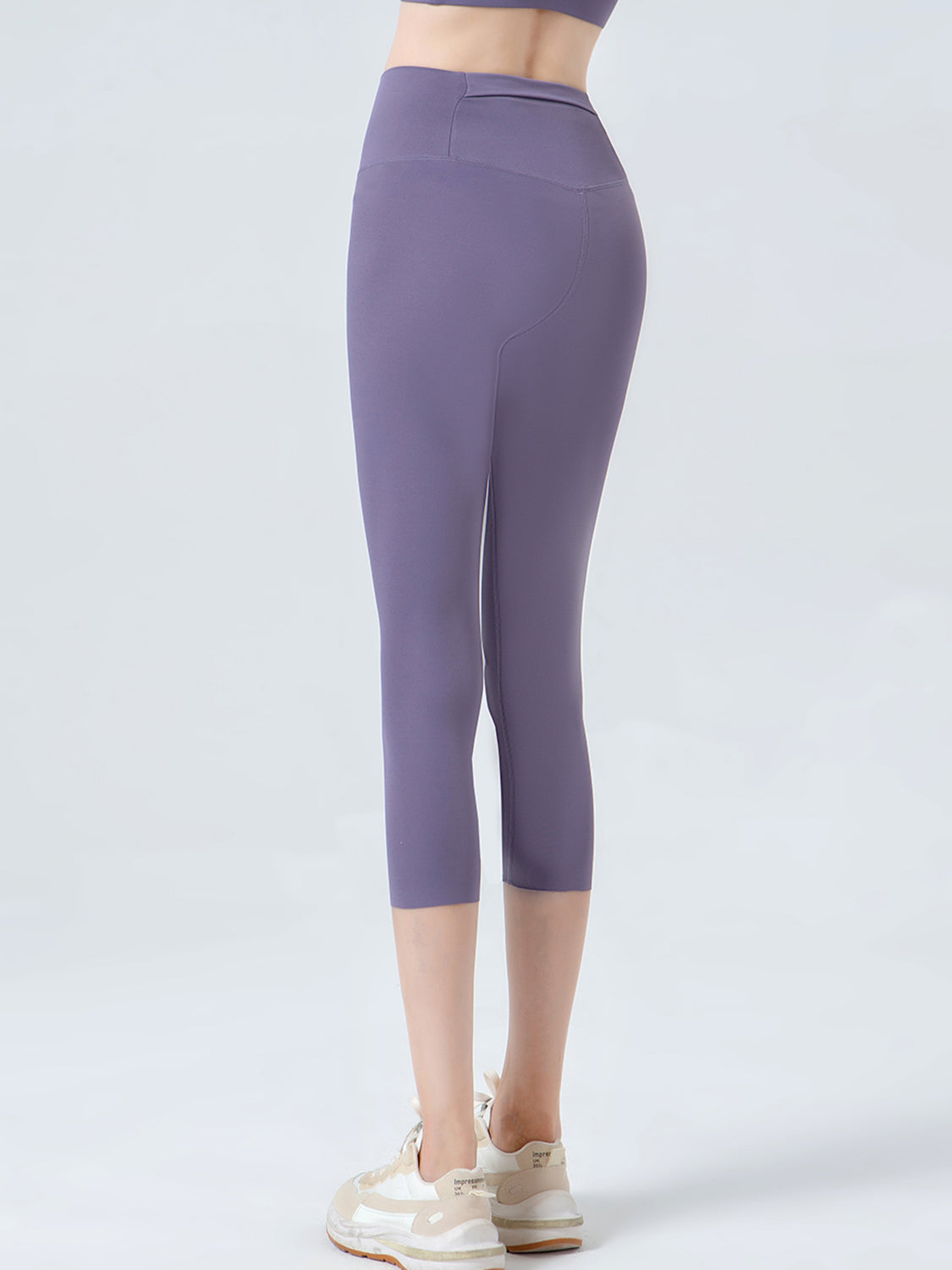 Wide waistband cropped sports leggings styled with denim