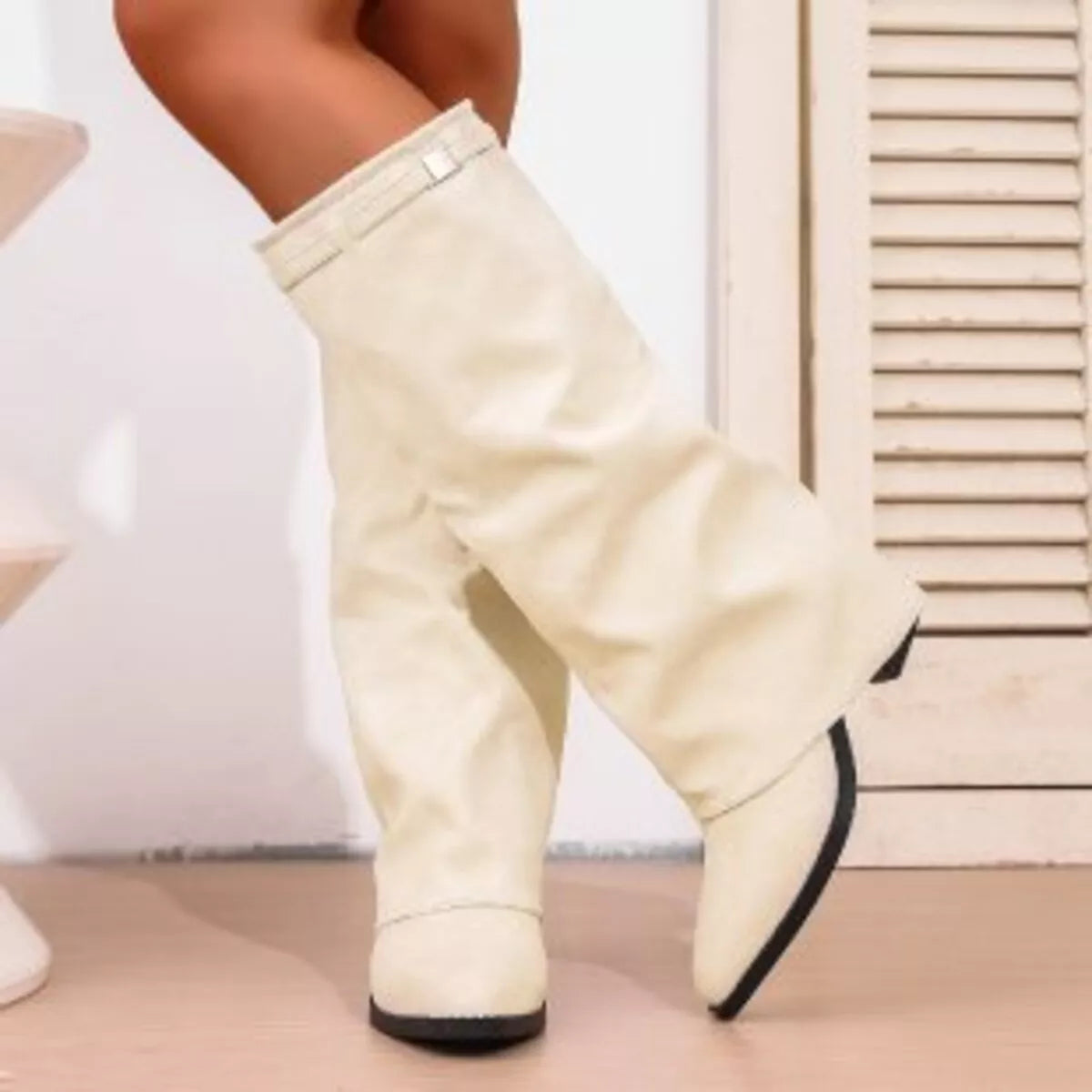 Point toe block heel boots angled view