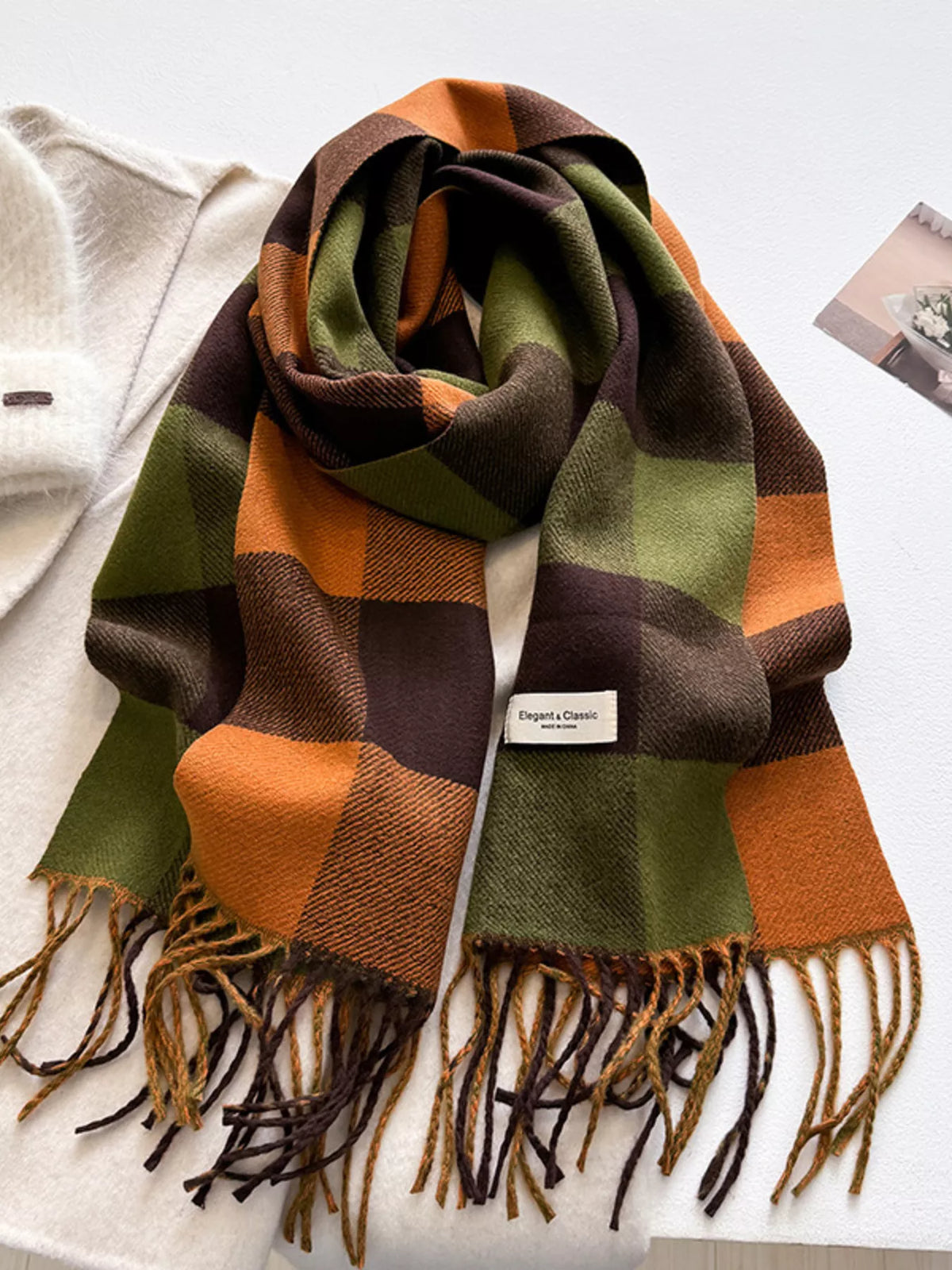 Cozy plaid wrap styled over a coat