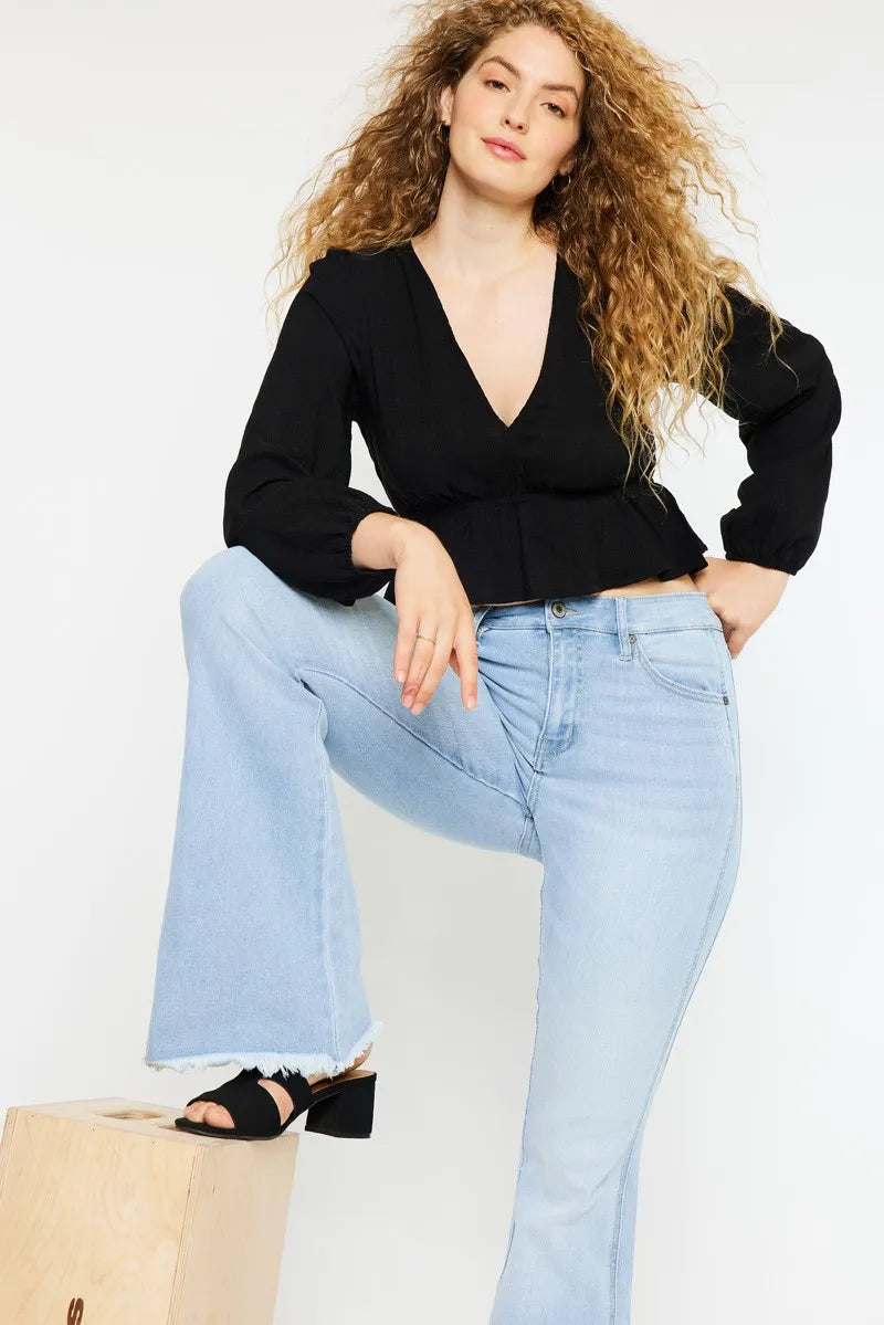 Light wash curvy jeans styled with heels
