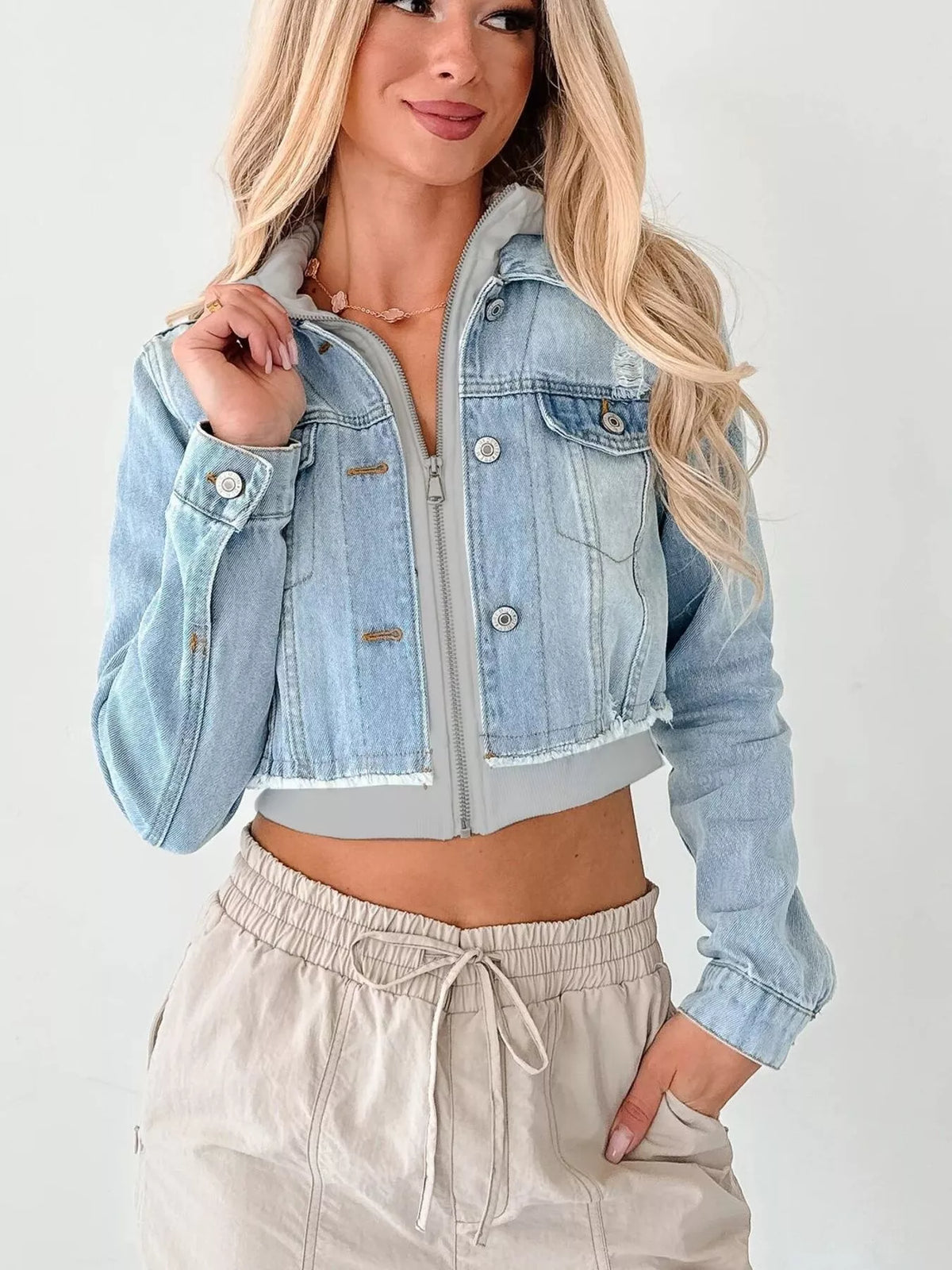 Distressed Cropped Hooded Denim Jacket in Light Blue close up
