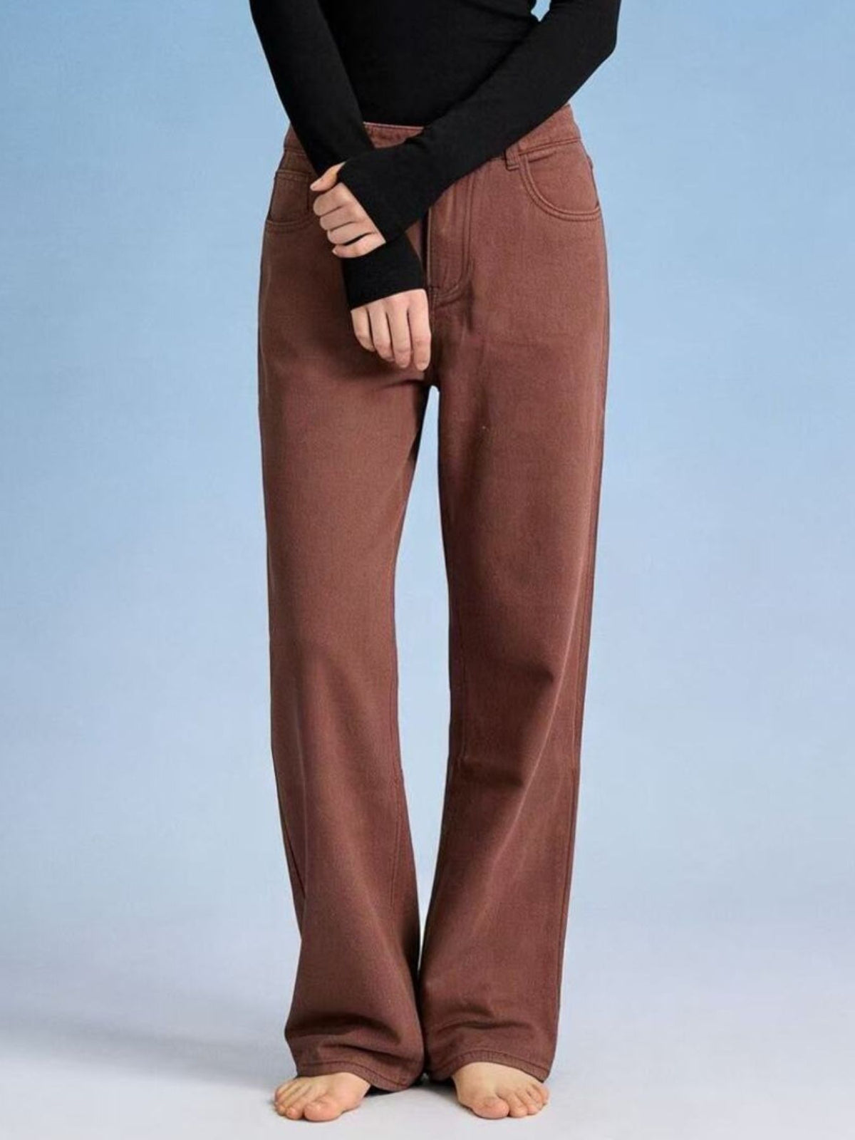 Full outfit view of butterfly back wide leg jeans