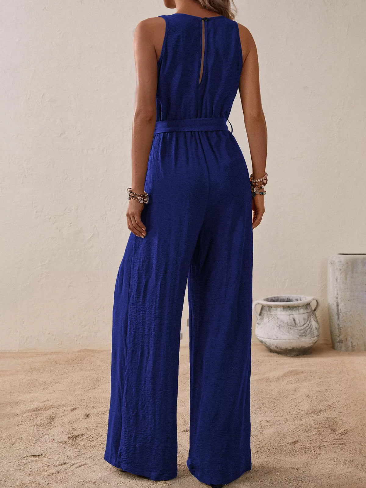 Sleeveless tie waist wide leg jumpsuit fabric detail