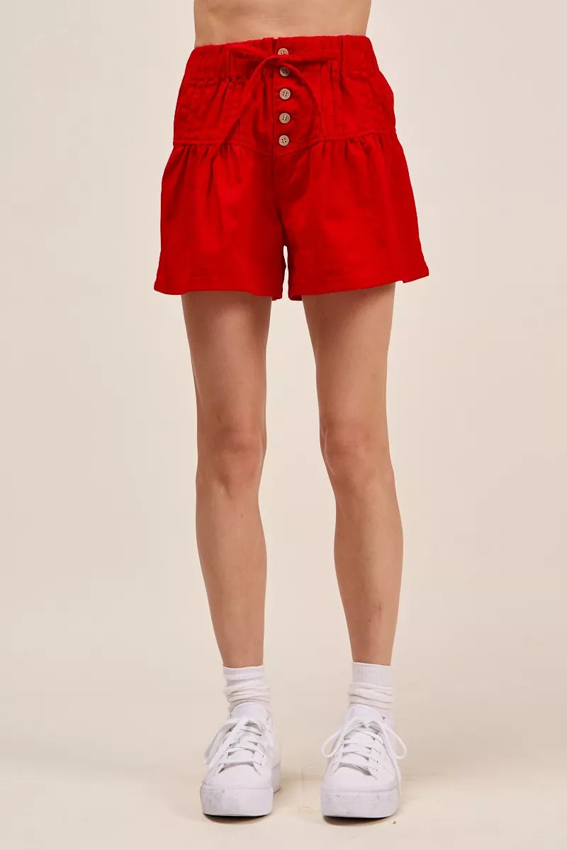Red pintucked ruffle hem shorts side view