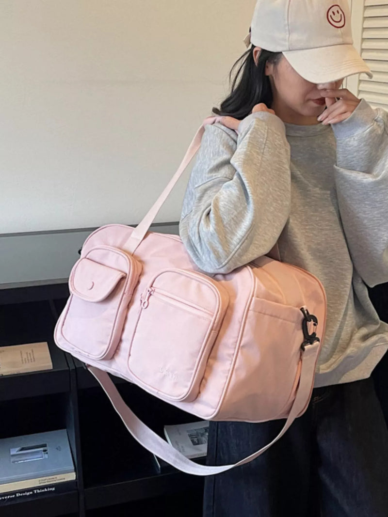 Pink nylon duffel bag front view