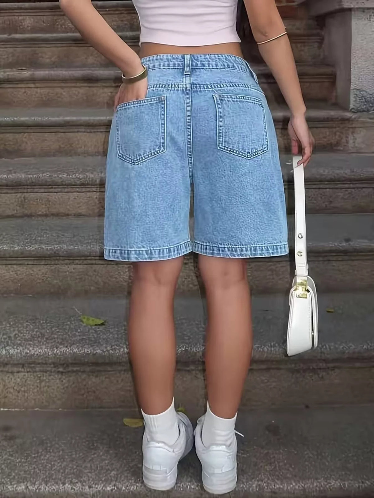 Light blue denim shorts back view
