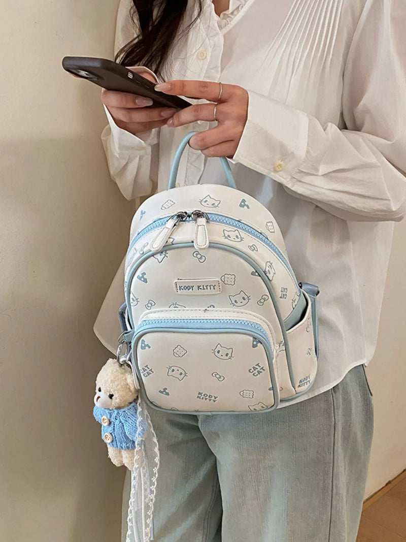 Cartoon pattern mini backpack in pastel blue front view