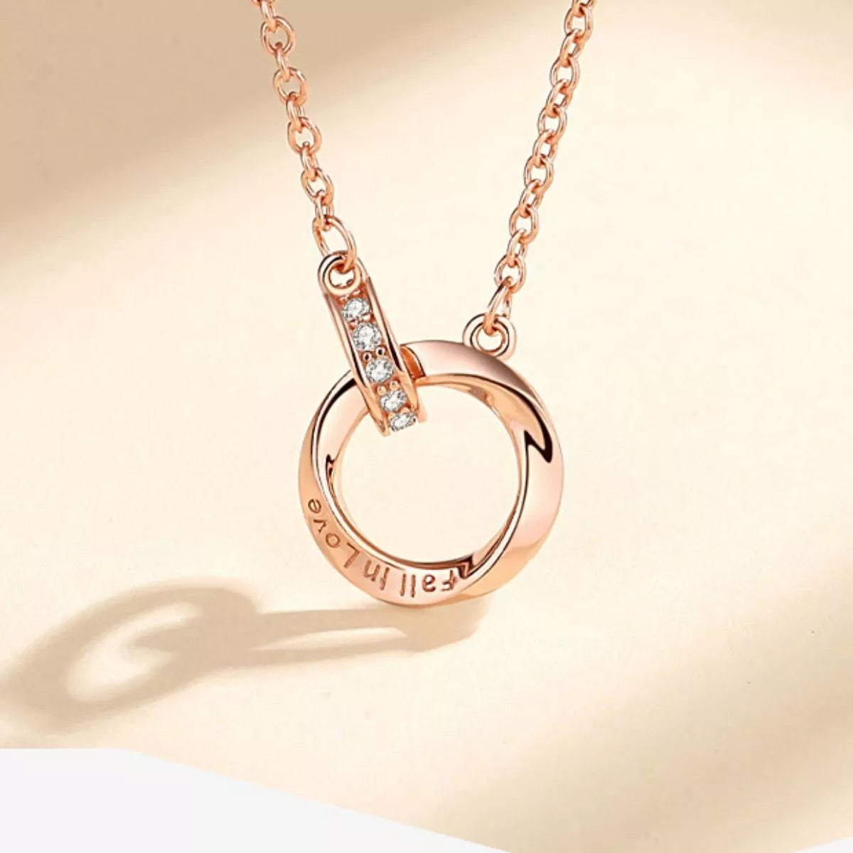 Rose gold necklace worn at the collarbone