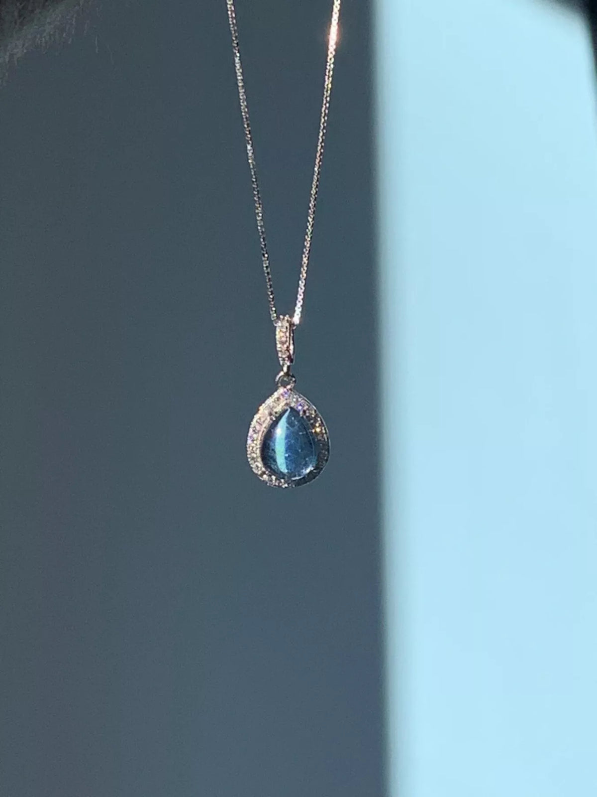 Crystal teardrop pendant sterling silver necklace, styled on model