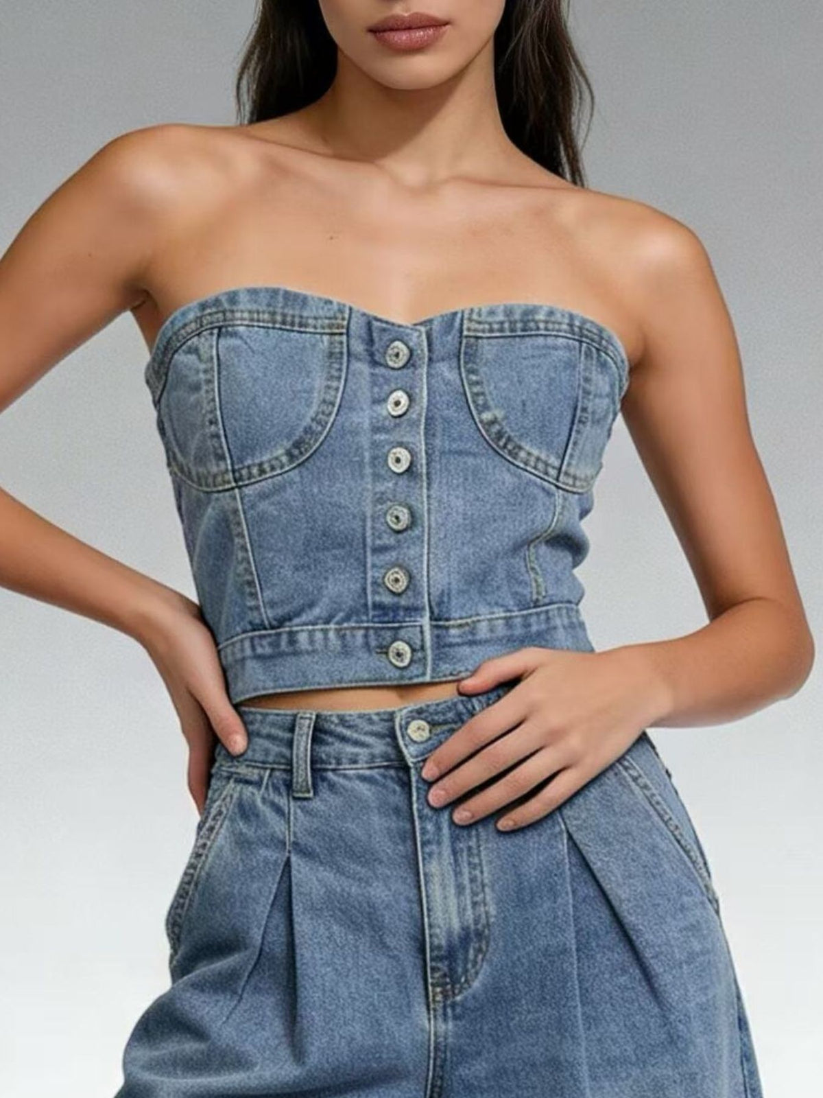 Model wearing the tube top with an open shirt layered over