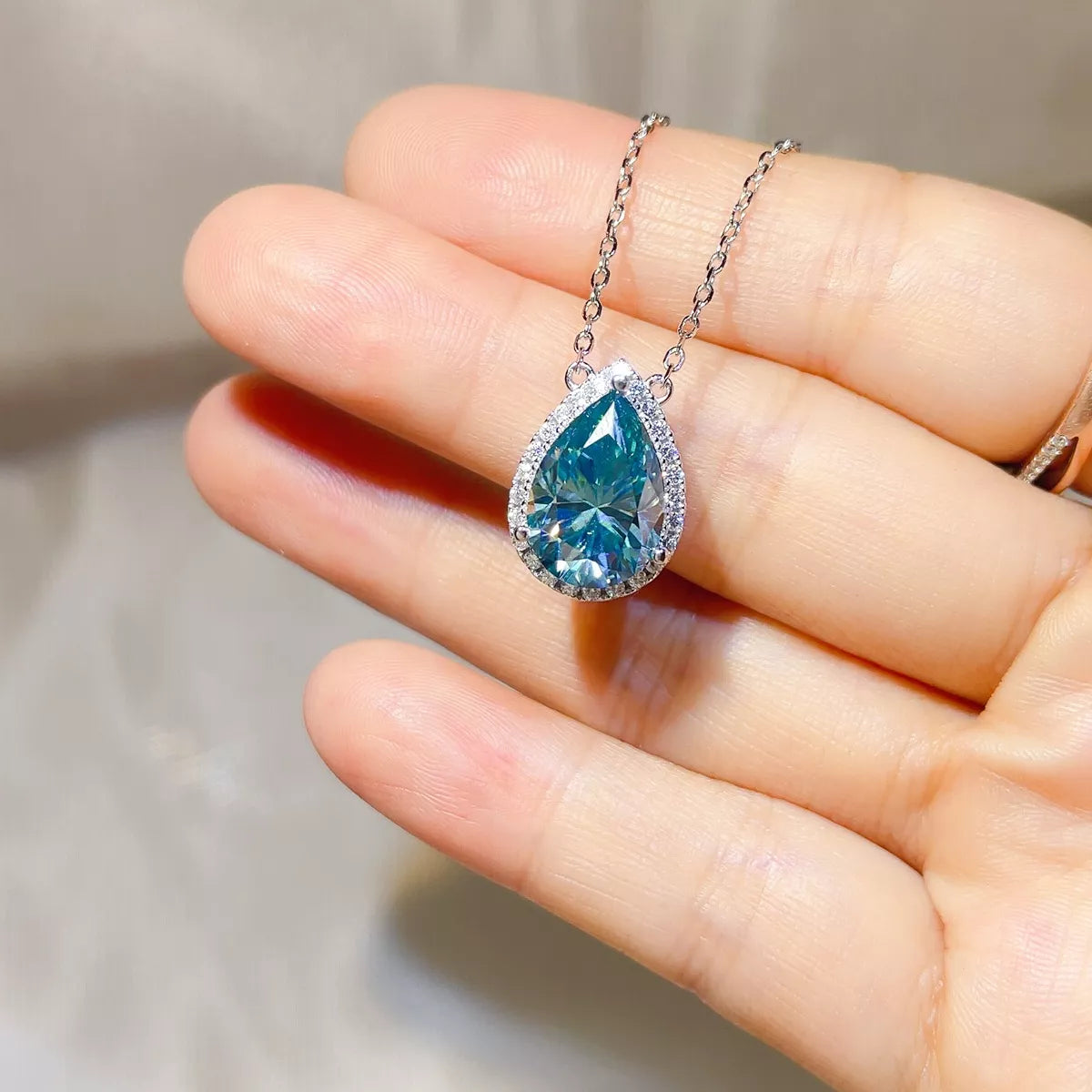 Sterling silver moissanite necklace worn at the throat