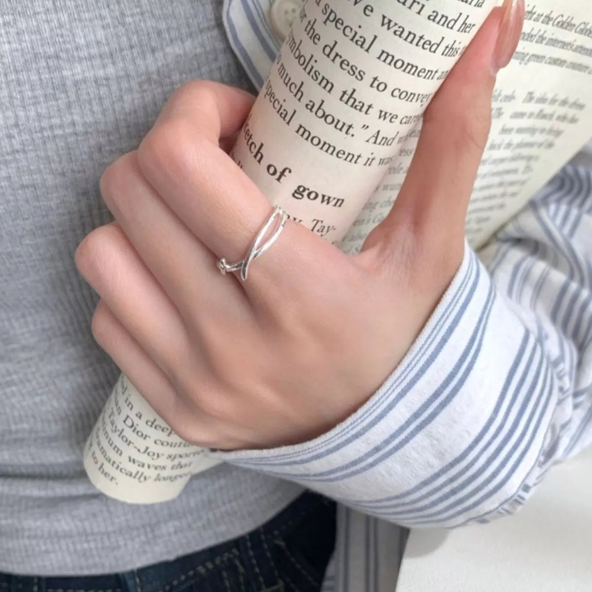 Silver open ring shown with matching box