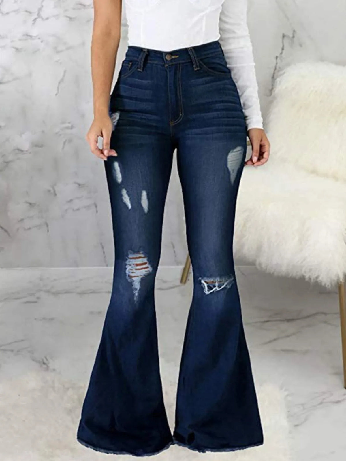 Plus size distressed raw hem flare jeans front view
