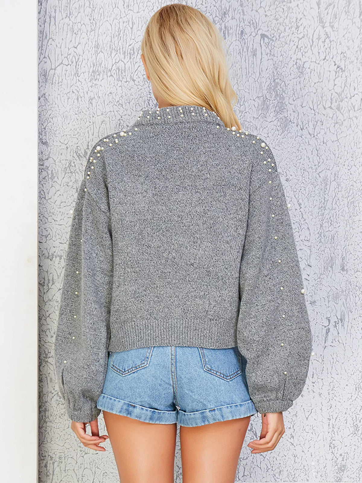 Side view of the soft knit mock neck sweater
