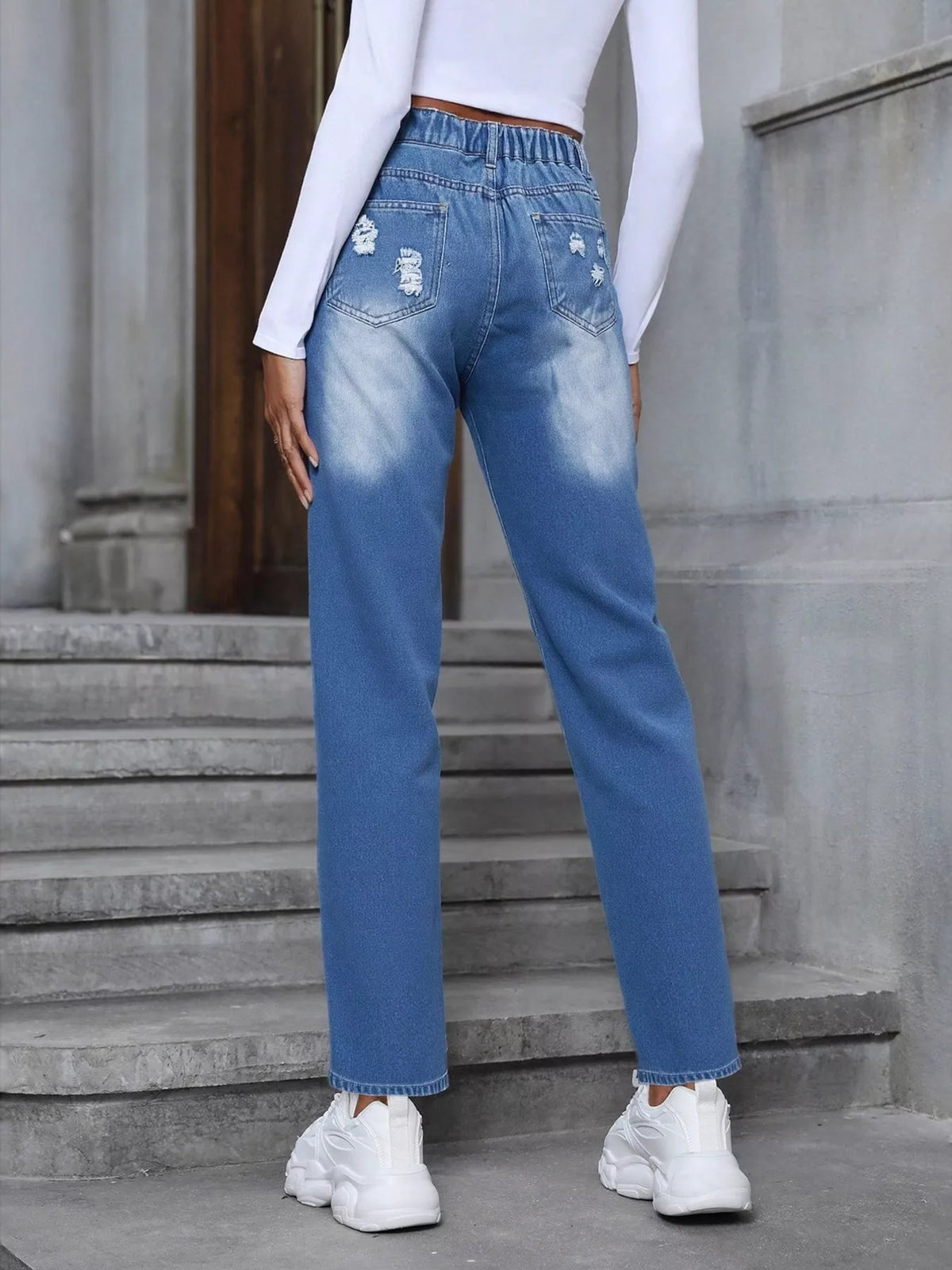 Full length styling of embroidered distressed jeans