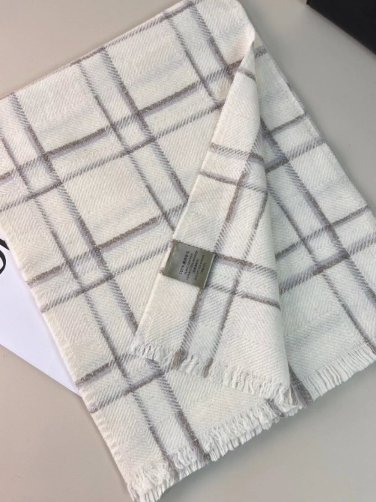 Classic plaid winter scarf styled casually