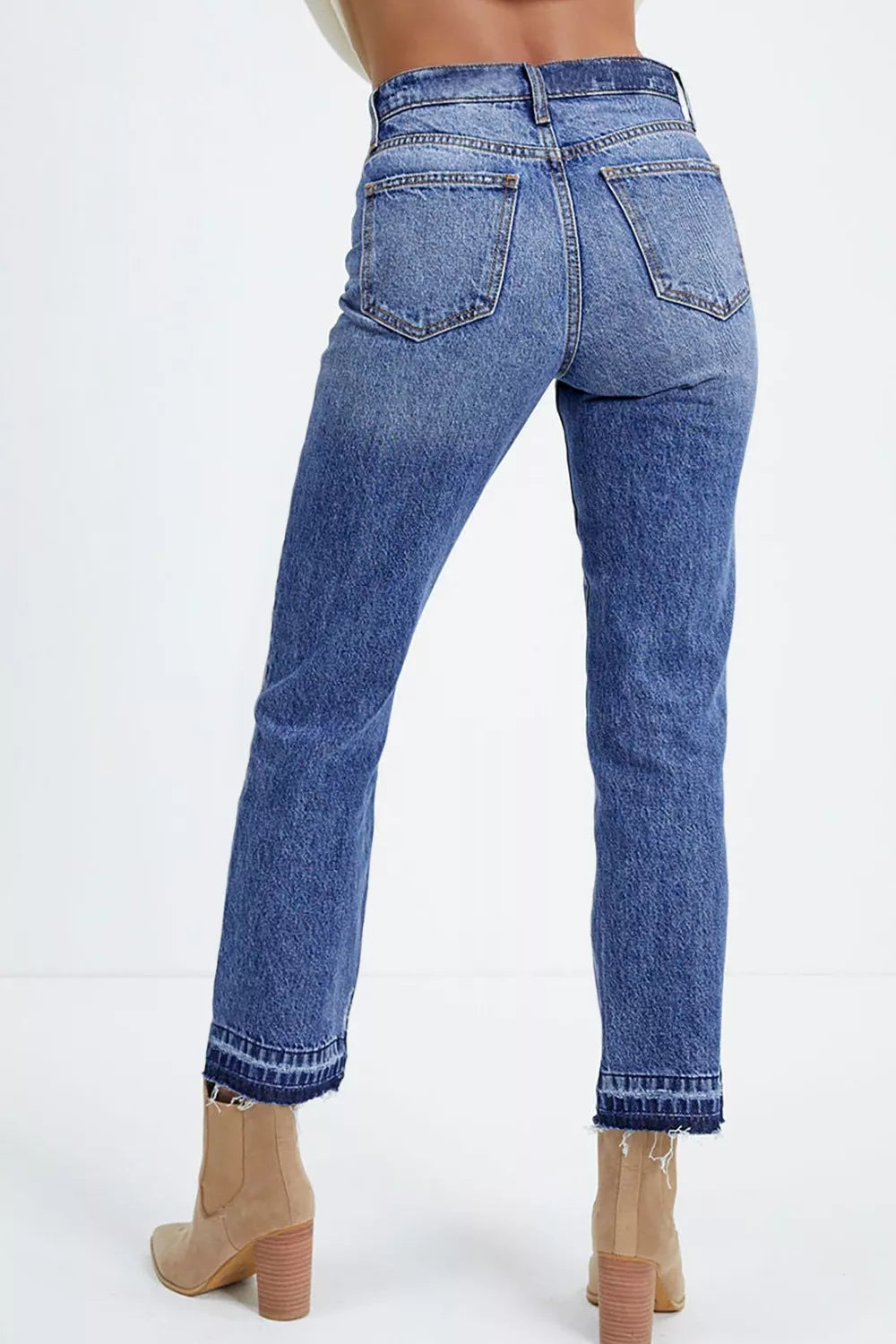 Cropped denim side profile with raw hem