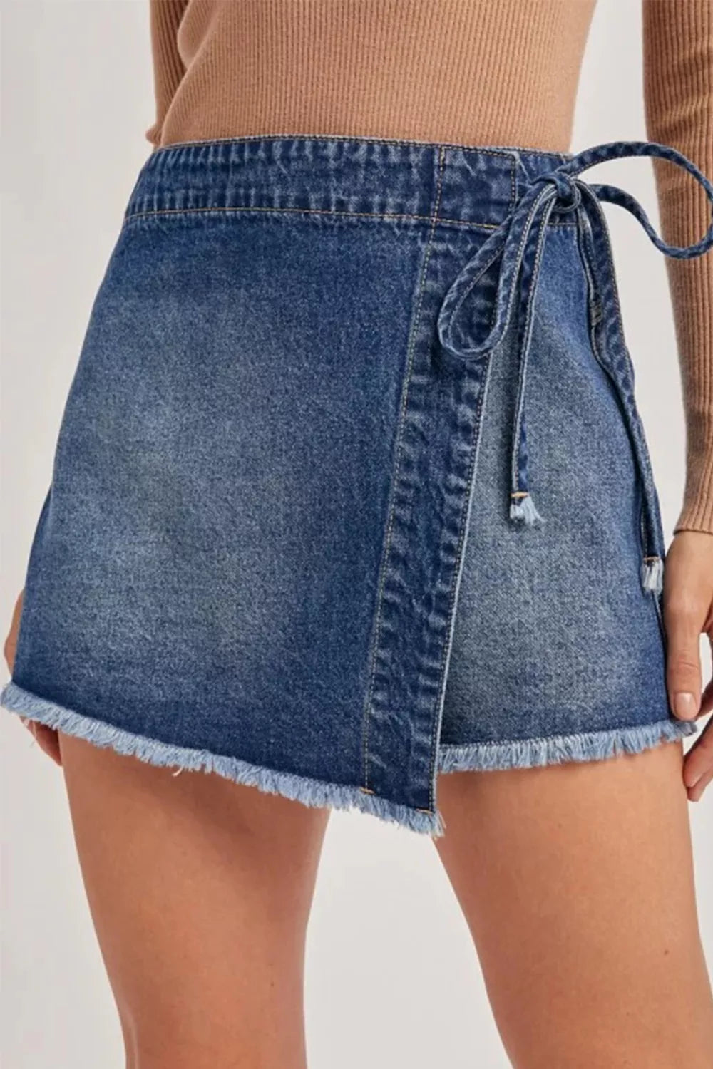 Medium wash wrapped tie waist denim skort front view