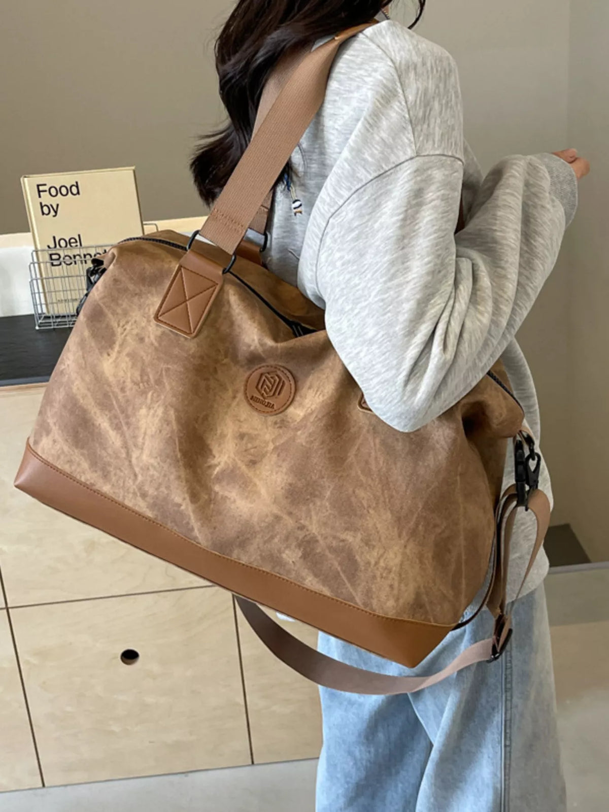 Brown leather duffel side view