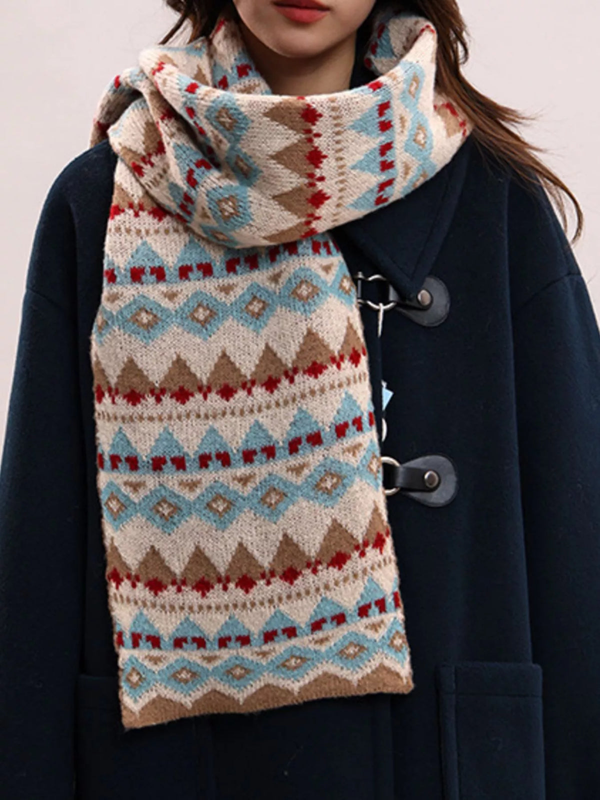 Close view of the geometric pattern on the knitted scarf