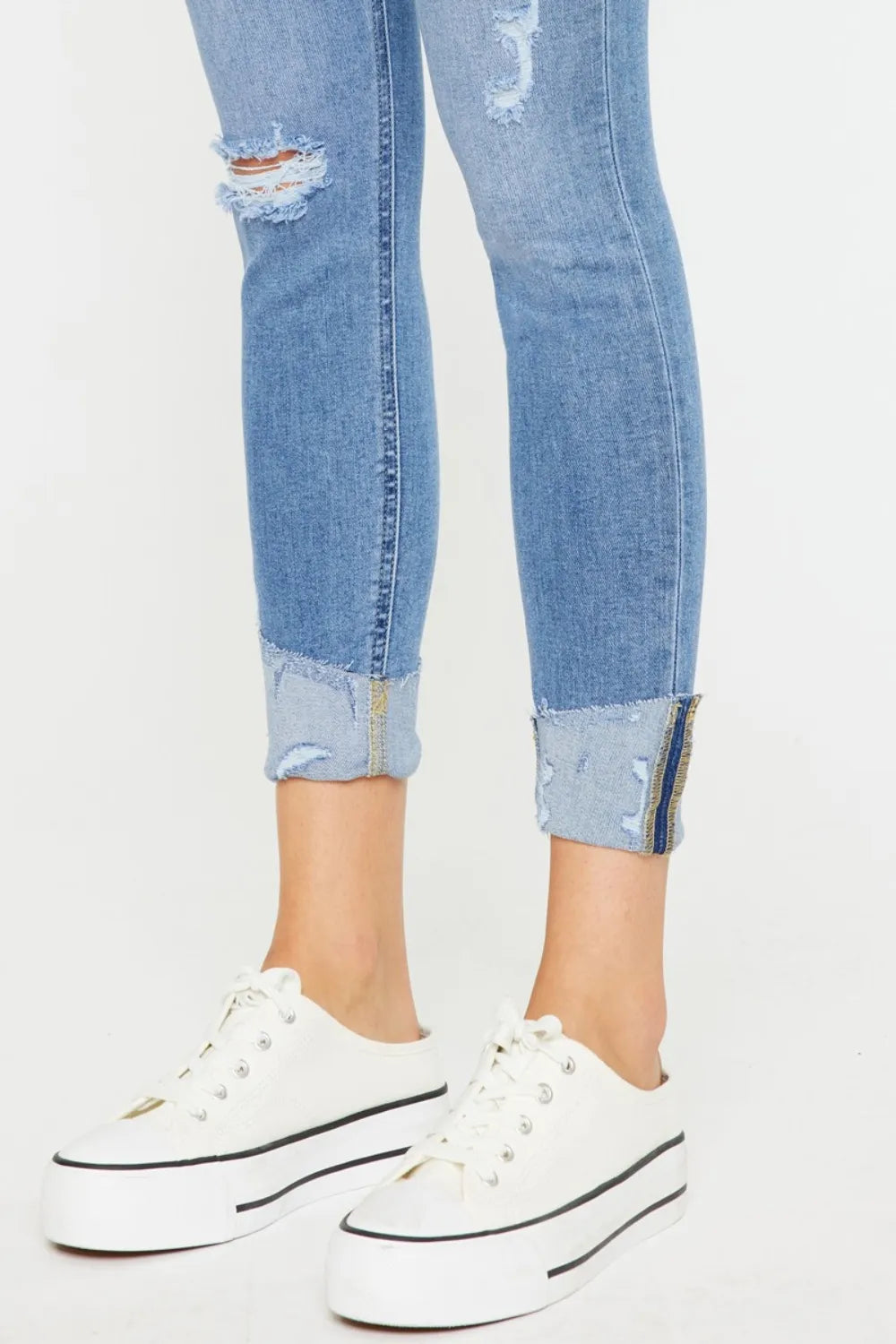 Light wash cat whisker skinny jeans styled view