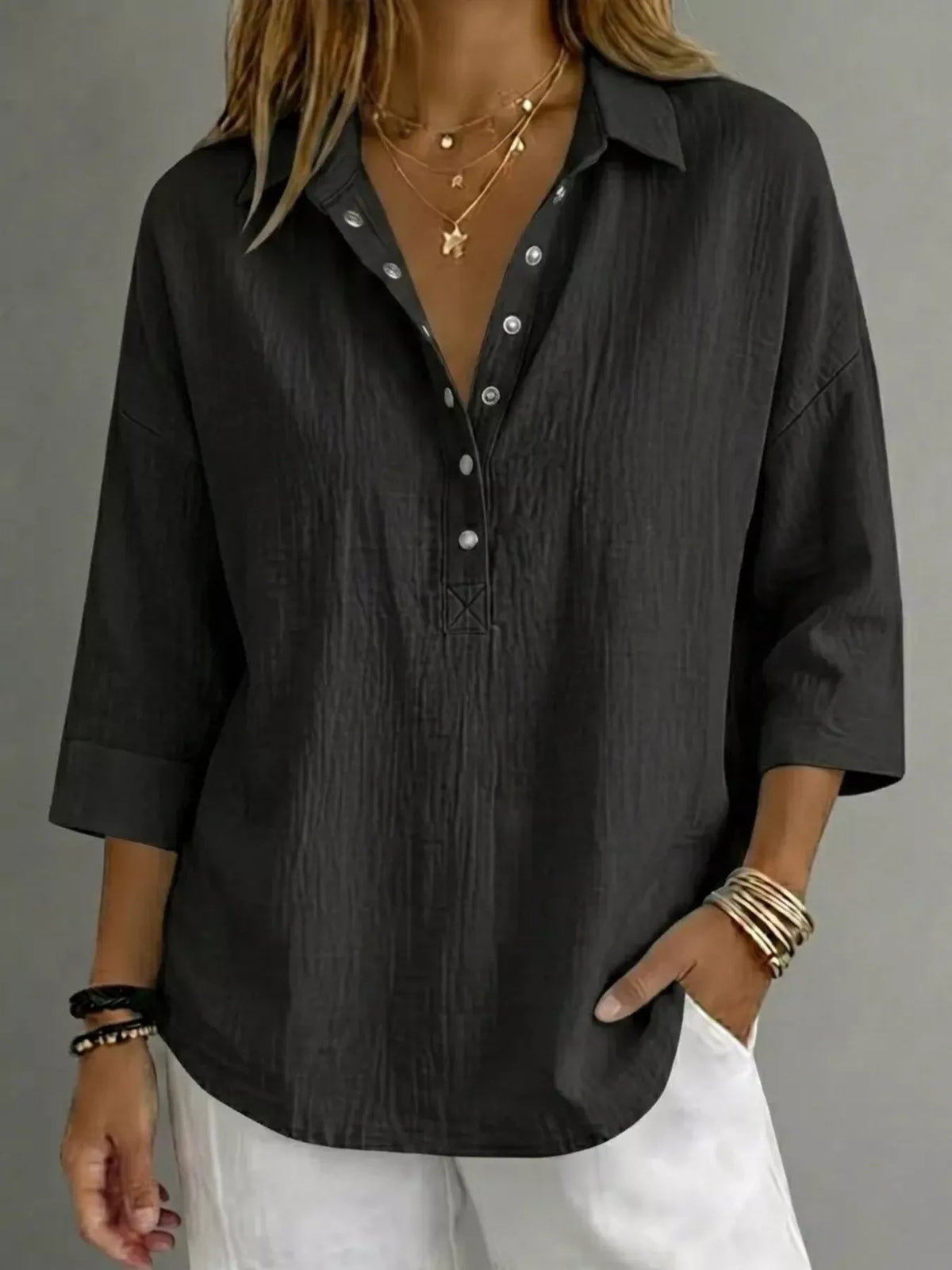 Snap down blouse worn open over a tank as a light layer