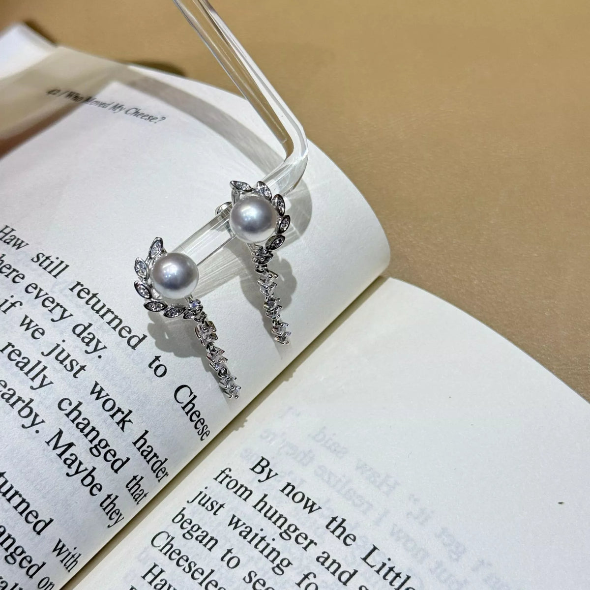 pearl and zircon silver drop earrings styled on ear