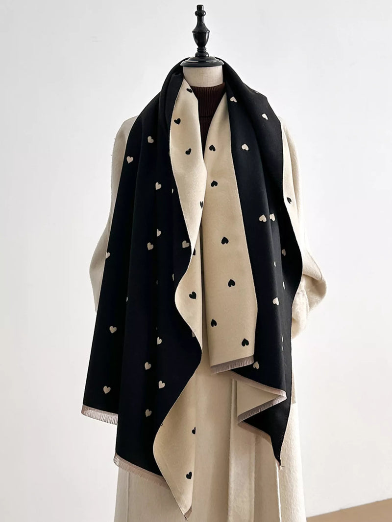 Heart raw hem scarf shown draped around the neck
