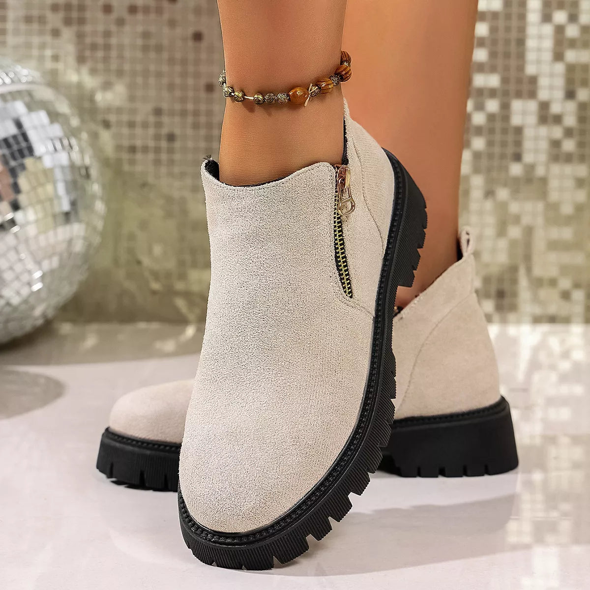 Round toe side zip ankle boots standing pose