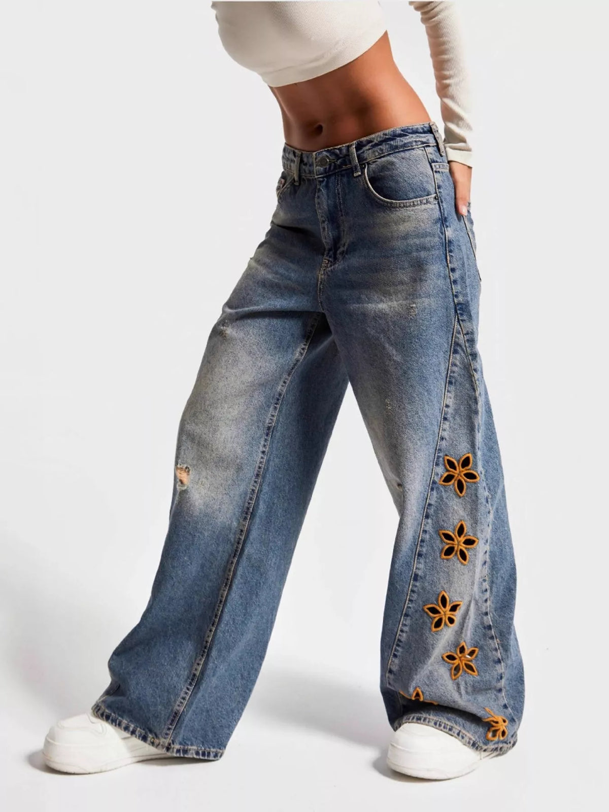 Blue floral embroidered wide leg jeans front view