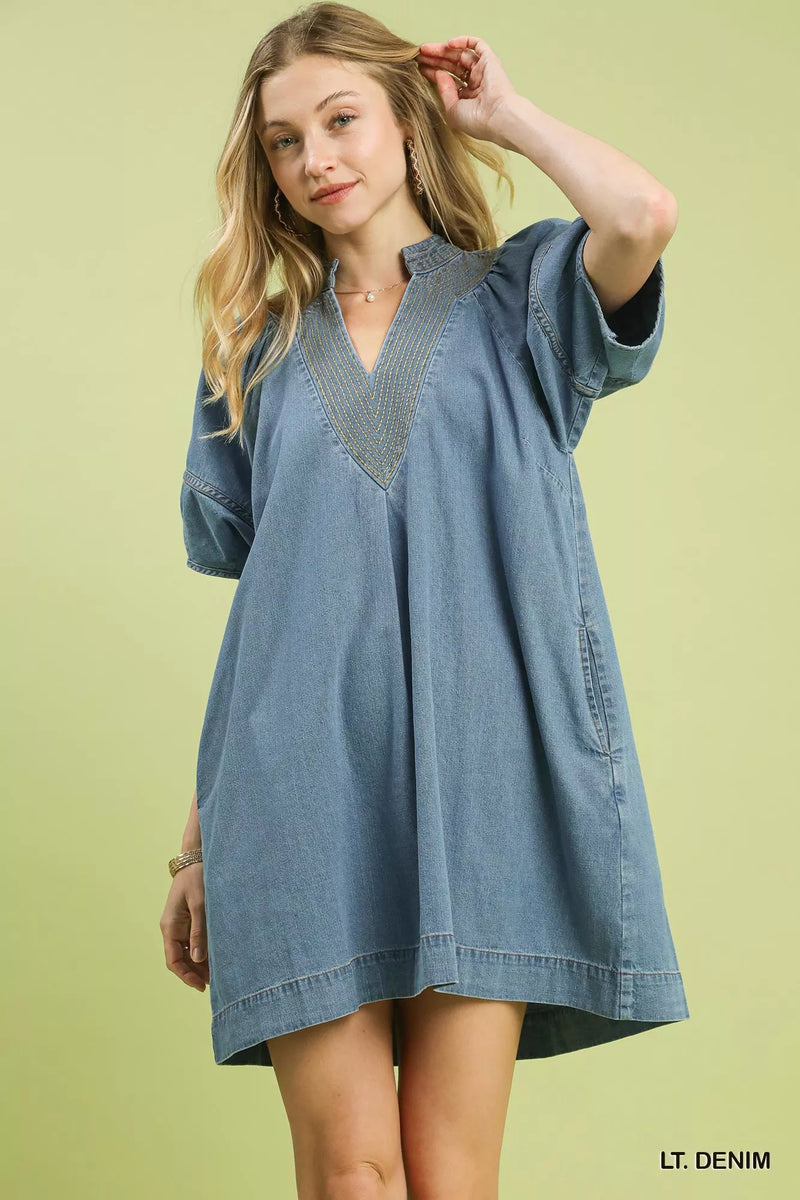 Light denim mini dress with contrast thread front view on model