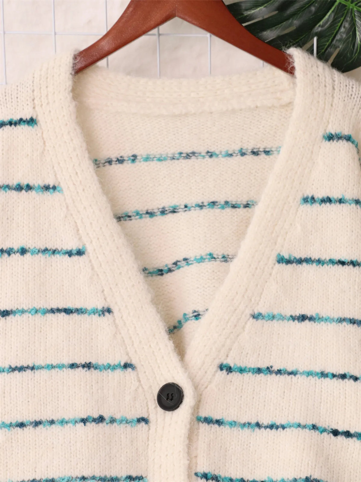 Striped button up v neck cardigan close up of the neckline