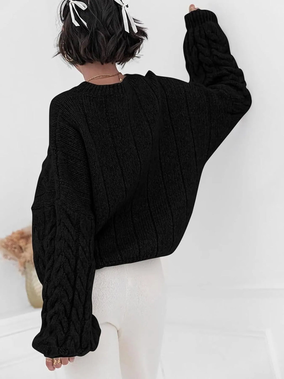 cable knit long sleeve sweater flat lay view