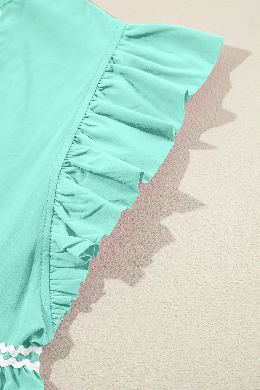 Ruffled mini dress fabric detail