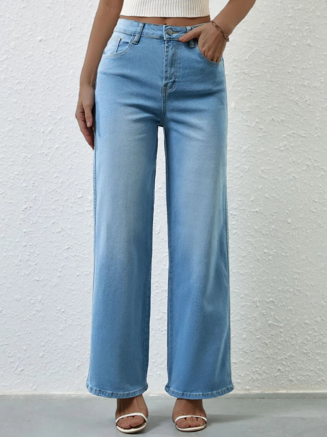 Wide leg jeans styled with a tucked in camisole