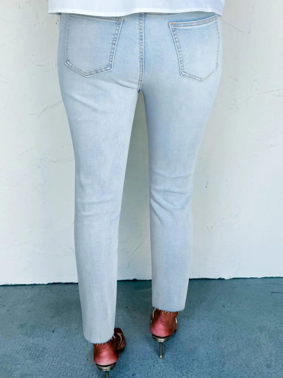 Light blue distressed skinny jeans side view
