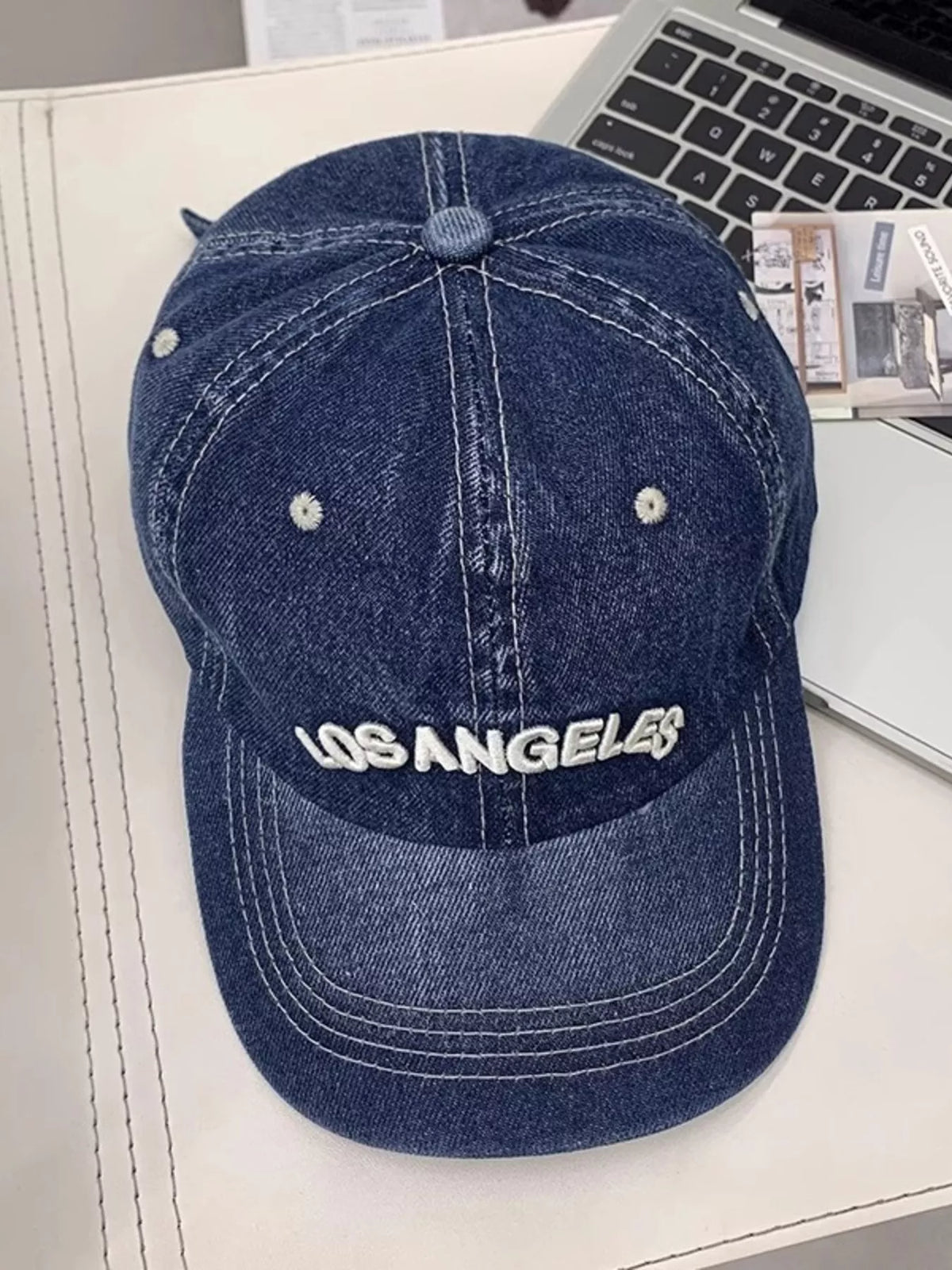 Denim cap back view with closure
