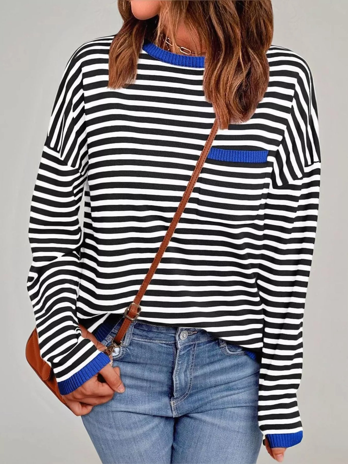 Striped round neck knit top flat lay view