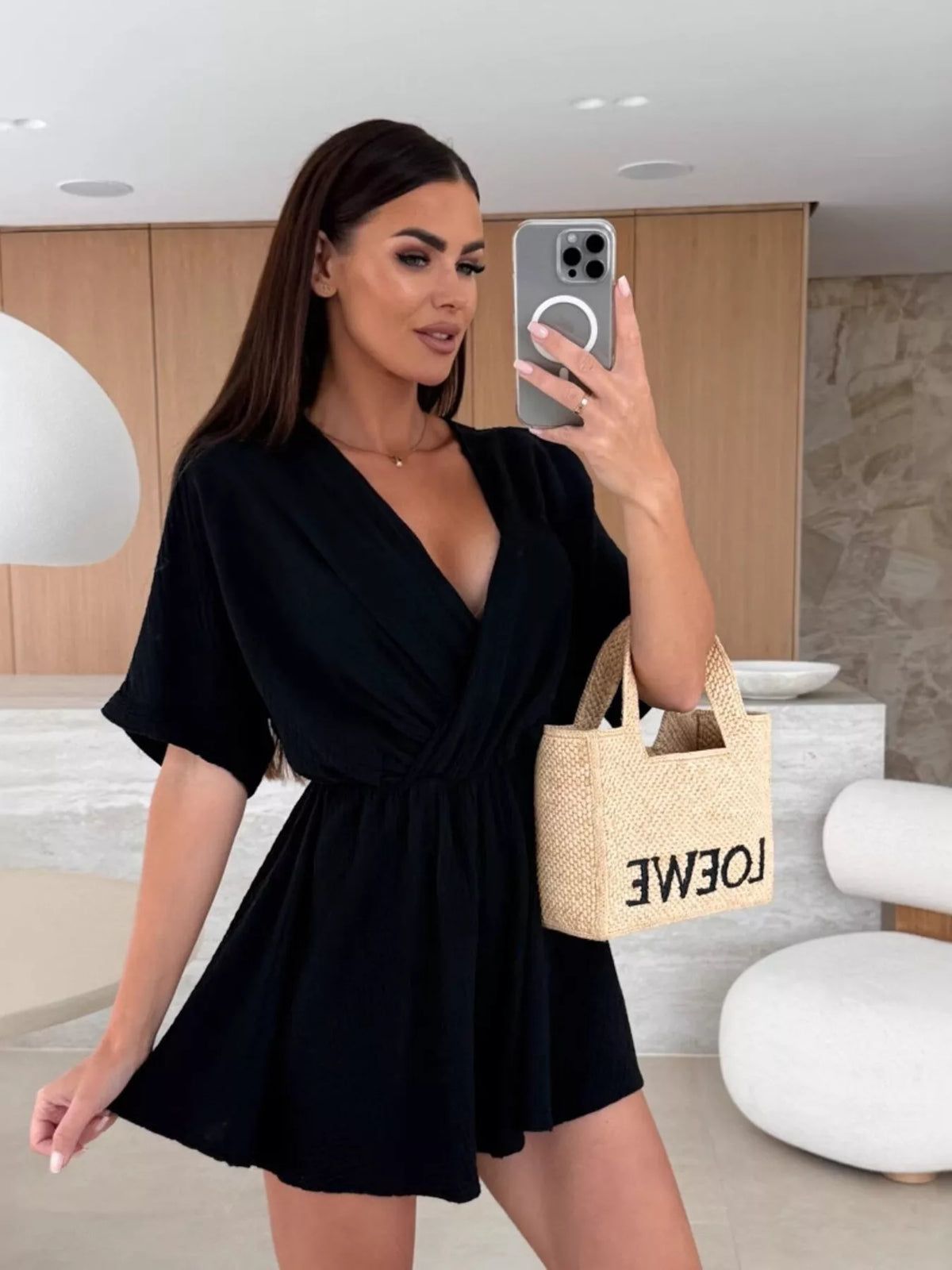 Surplice wrap front short sleeve romper detail view