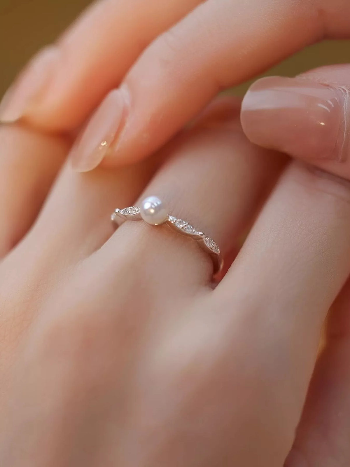 Pearl and zircon ring detail